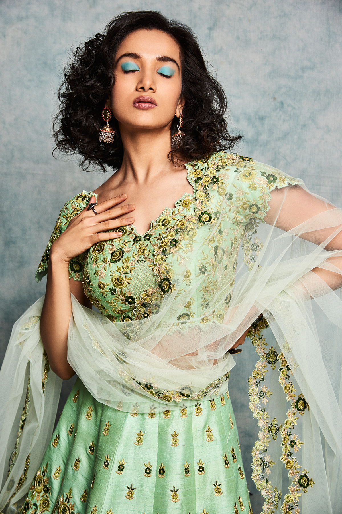 Green raw silk lehenga set with tulle dupatta closeview