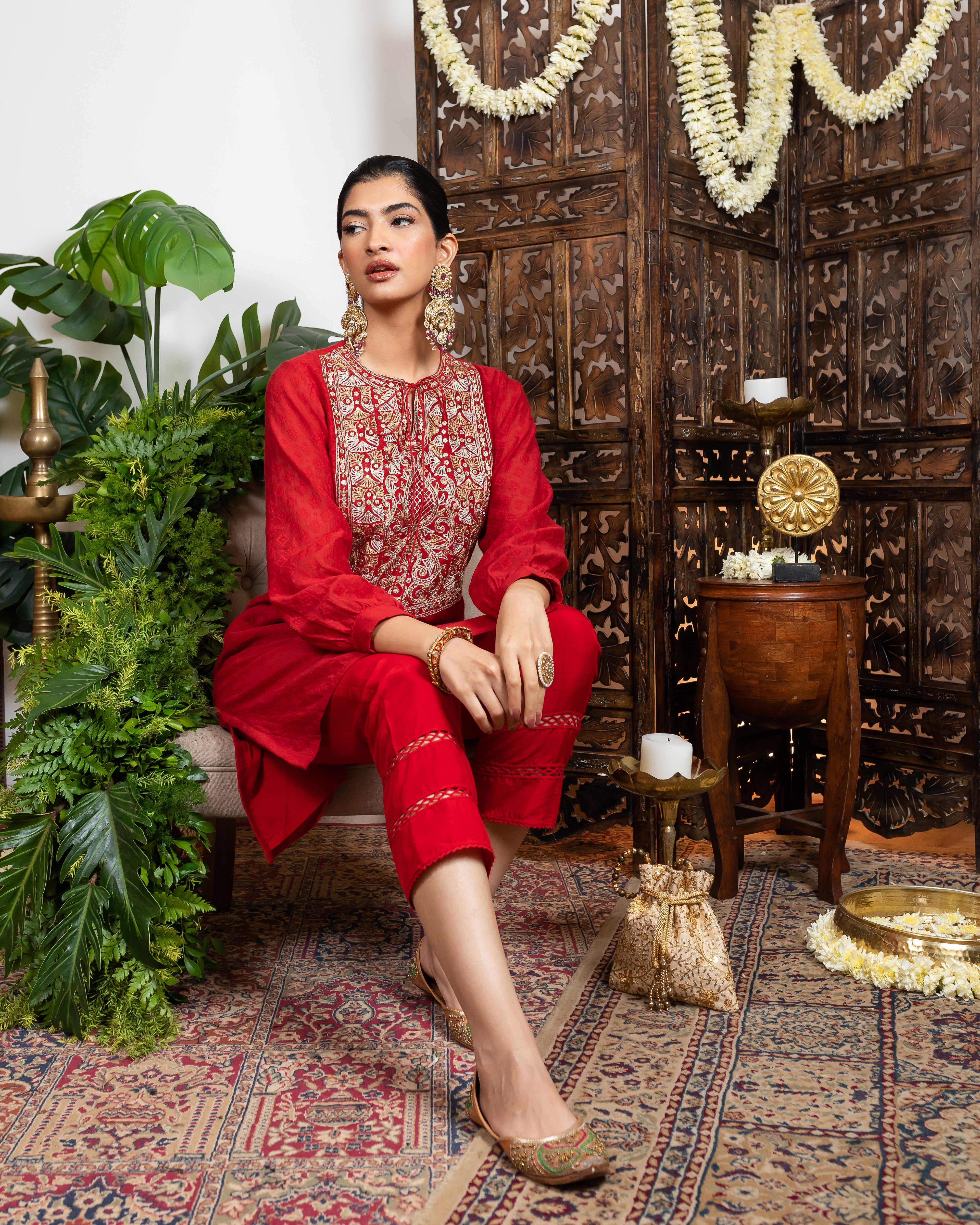 Red knee length kurta with embroidered yoke and tassles tie-up