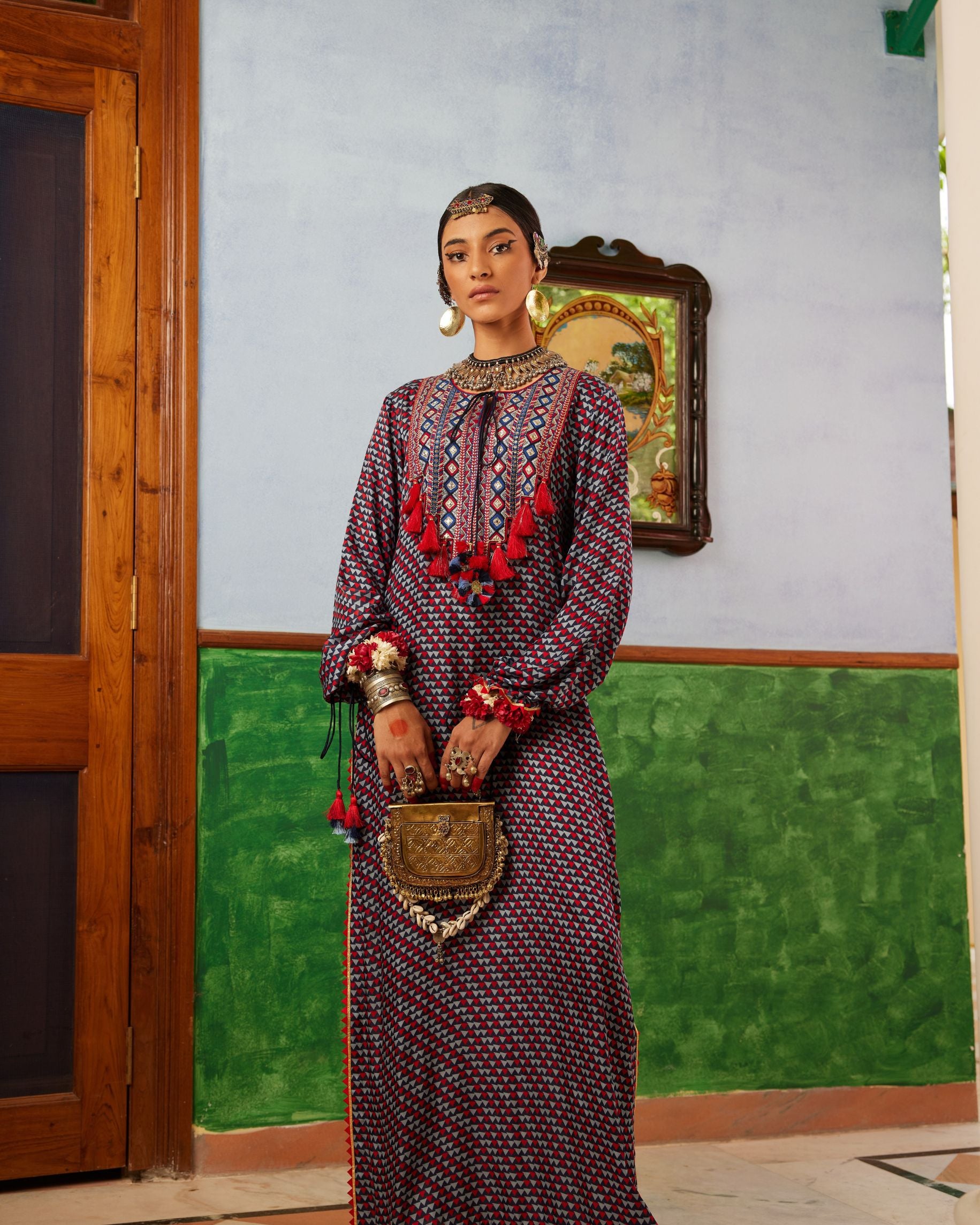 lue printed dress in satin base with embroidered yoke and tassel