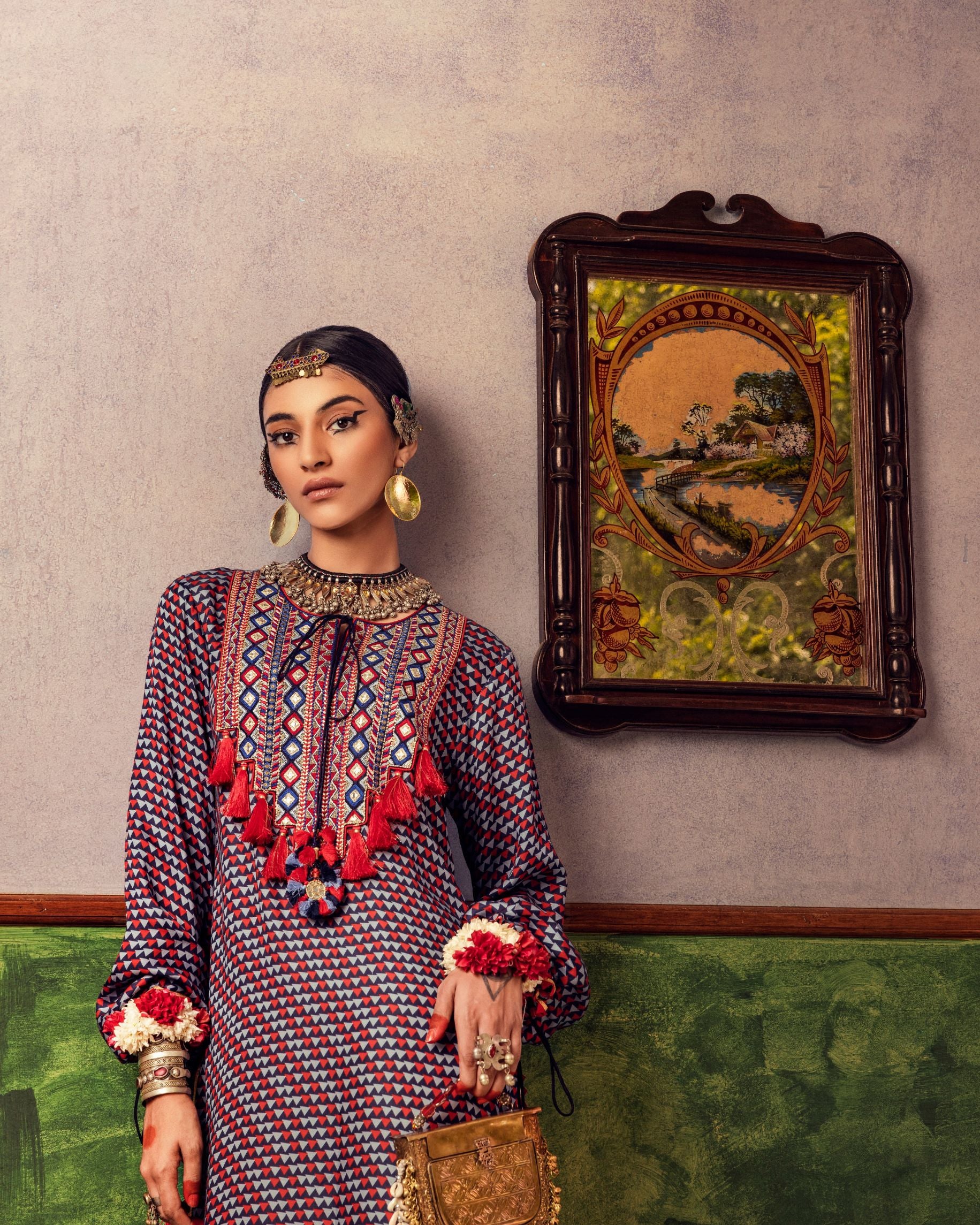 Blue printed dress in satin base with embroidered yoke and tassel