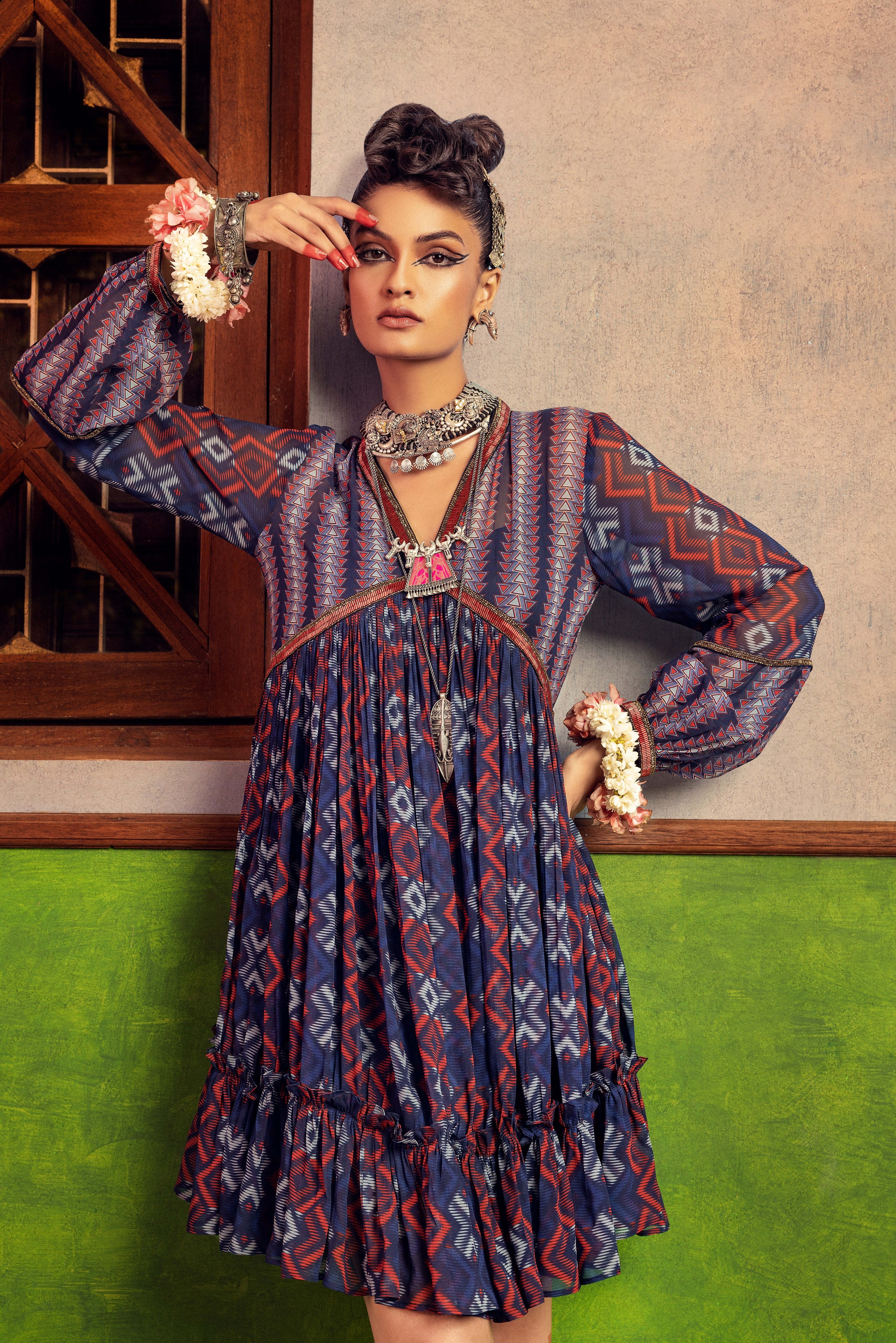 Blue printed dress in georgette fabric with embroidery.