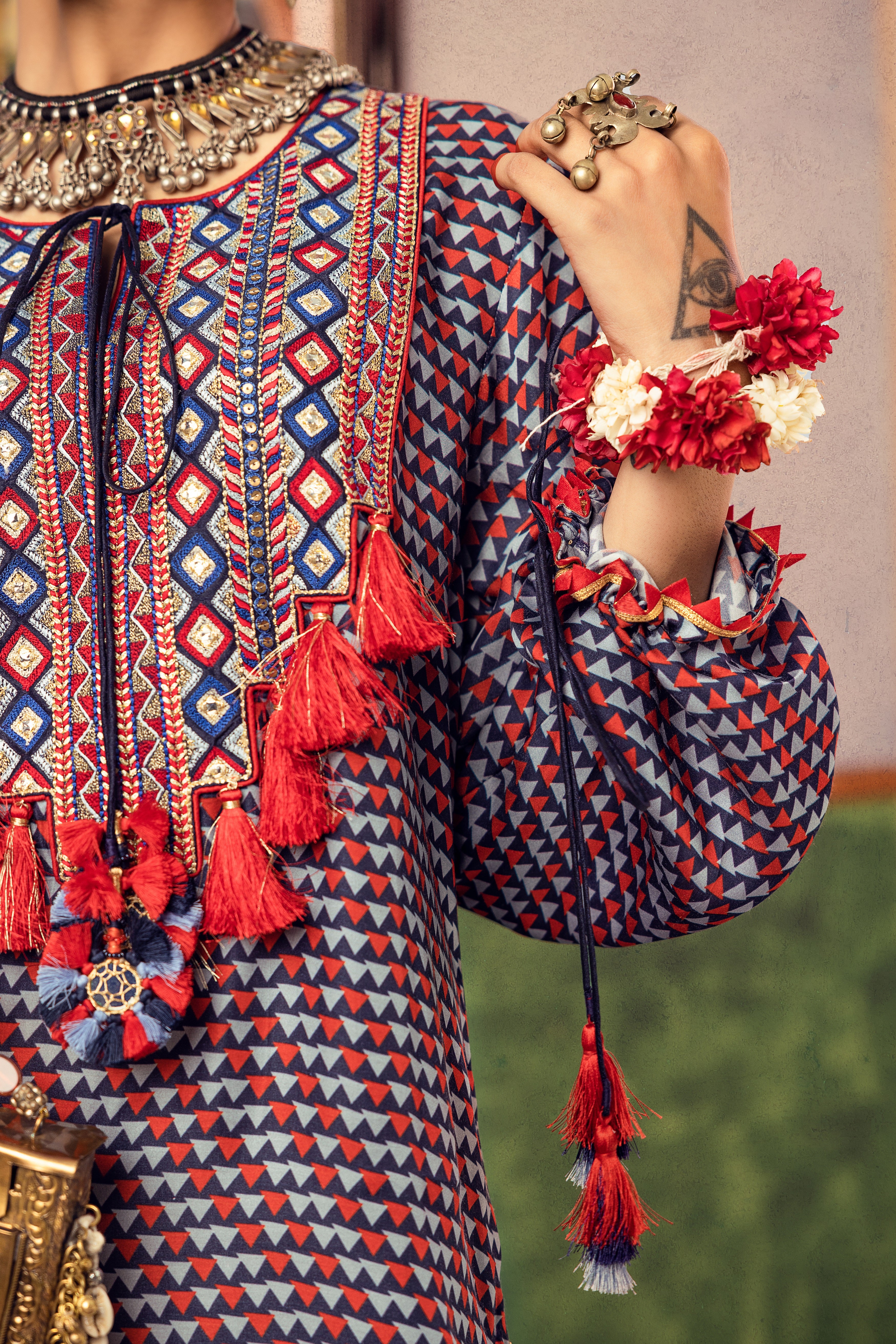 Blue printed dress in satin base with embroidered yoke and tassel Closeview