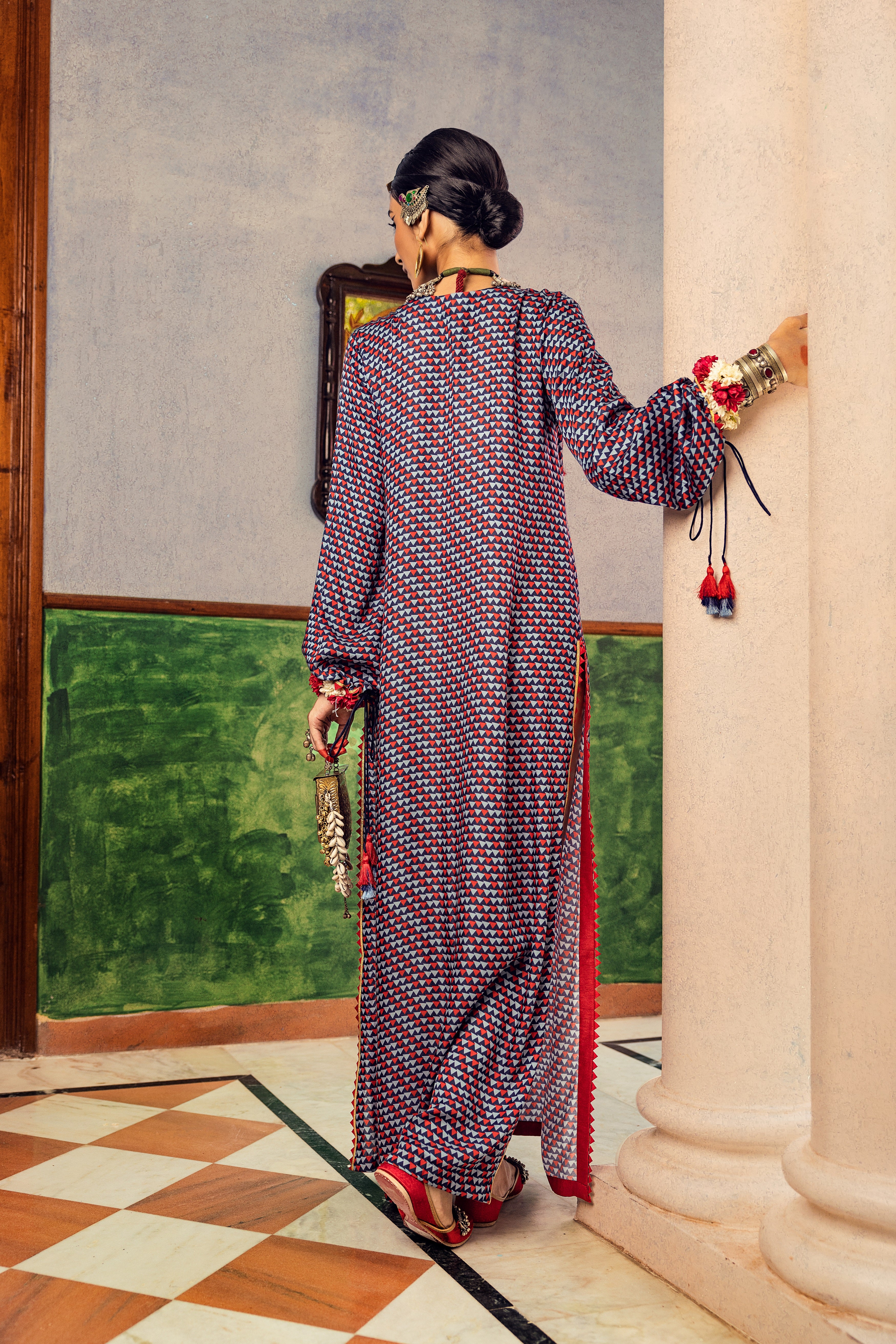 Blue printed dress in satin base with embroidered yoke and tassel Backview