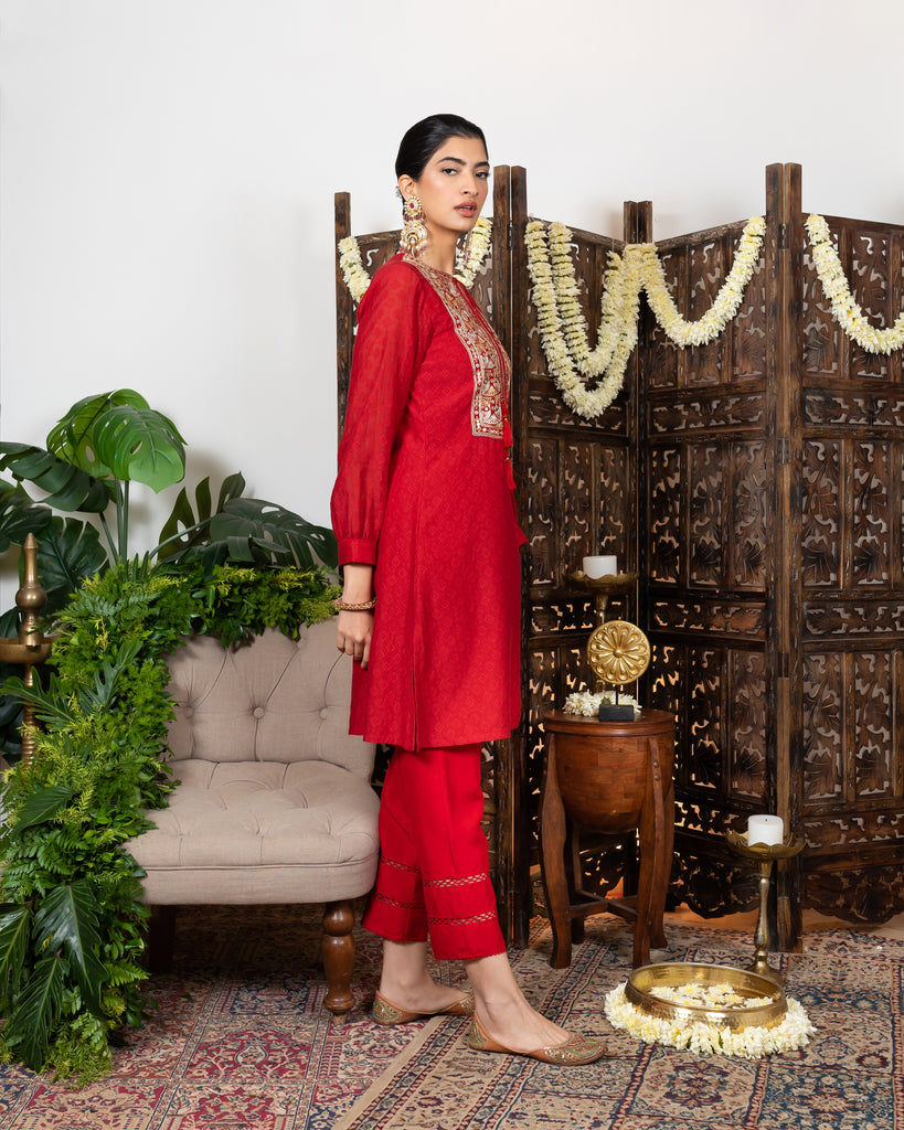 Red knee length kurta with embroidered yoke and tassles tie-up sideview