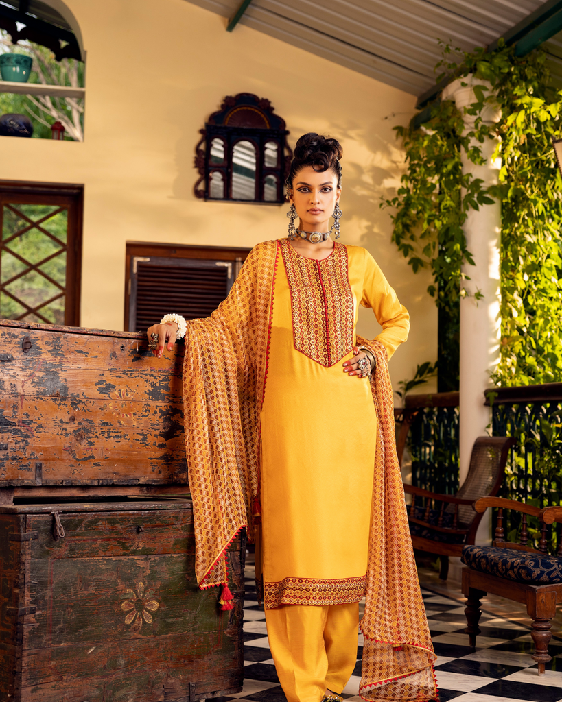 Yellow printed kurta in satin base with embroidery with  pants 