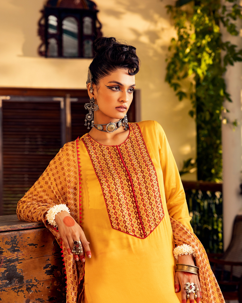 Yellow printed kurta in satin base with embroidery with  pants  Closeview