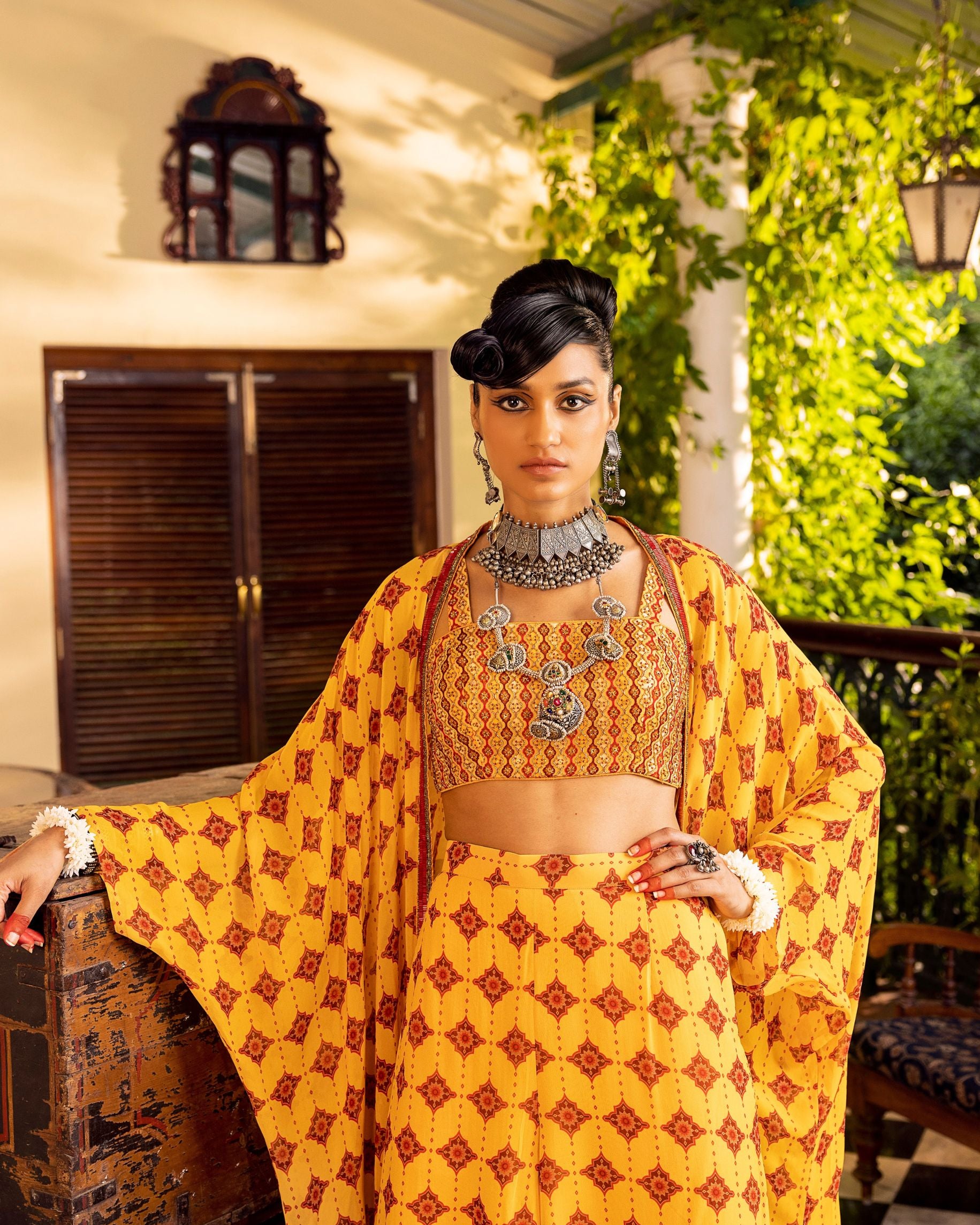 Yellow bustier in georgette with embroidery and print with  jacket and pants