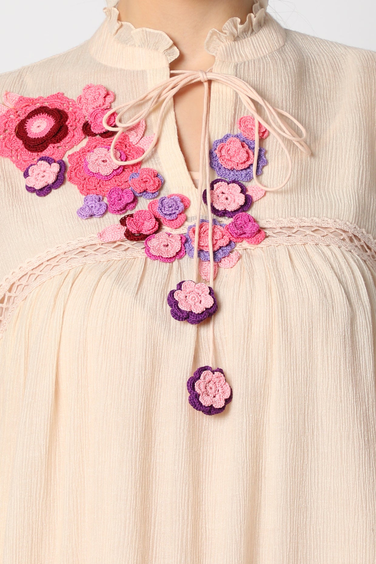 Pale pink Tunic dress in wrinkle cotton fabric with crochet flowers and lace details.